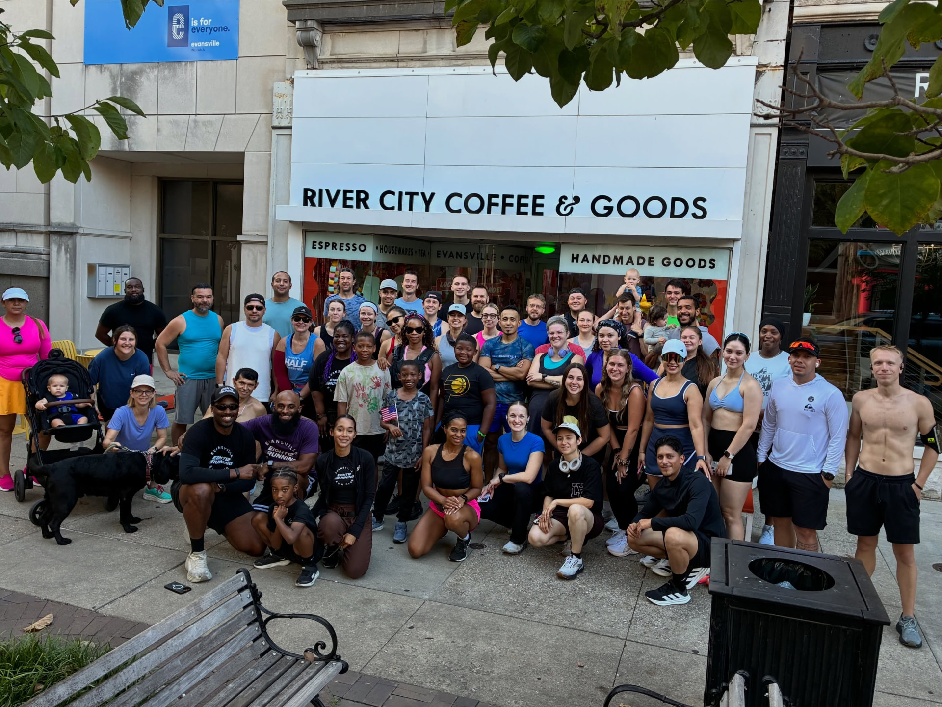 Eight12 runners and walkers gathered outside River City Coffee and Goods in Evansville